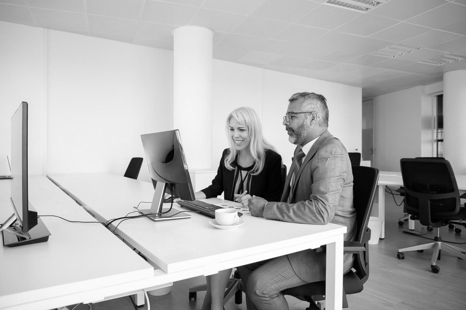 Students analyzing financial charts and market data during interactive learning session